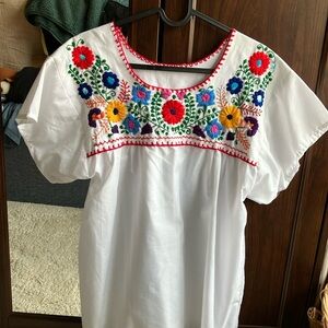 White hand made embroidered blouse made in Mexico.